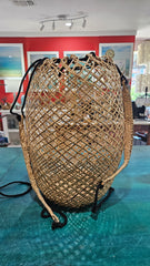 handwoven rattan backpack basket with natural braided straps and open lattice pattern 