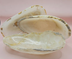 Raw-edge onyx dish with creamy polished interior 