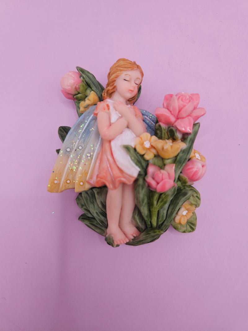 Fairy garden magnets with pastel wings and floral designs, each measuring approximately 3 inches.