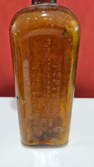 Antique amber Pepto-Mangan bottle with abalone shell and sea fan coral topper