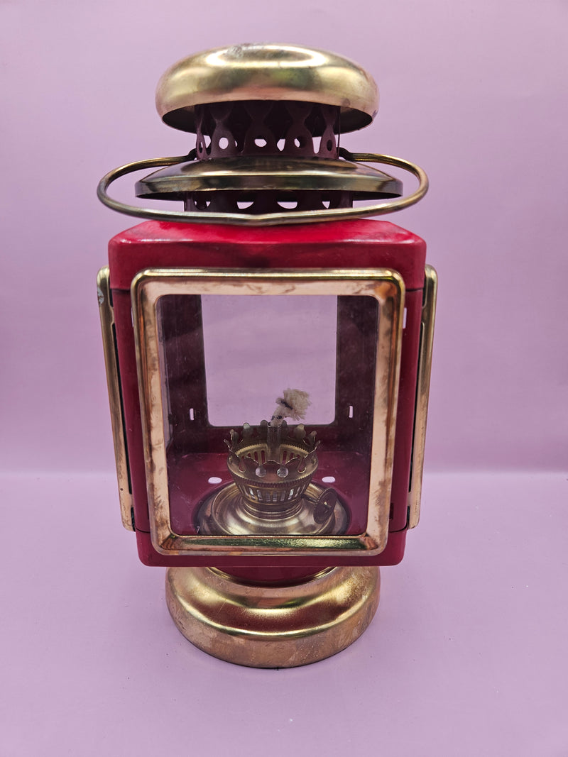 Vintage red and gold nautical oil lamp lantern with glass panels and vent, 7.5 inches by 4 inches, perfect for coastal decor