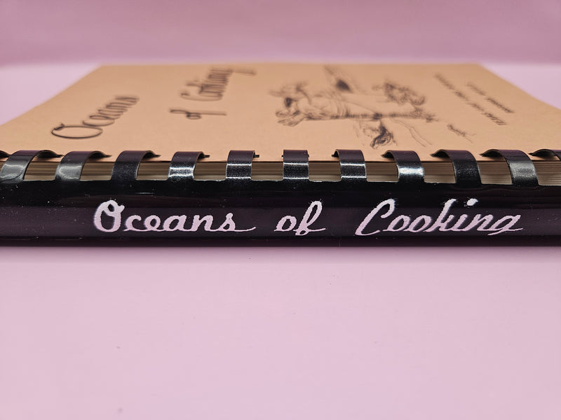 Oceans of Cooking cookbook featuring Texas Gulf Coast seafood recipes, 227 pages.