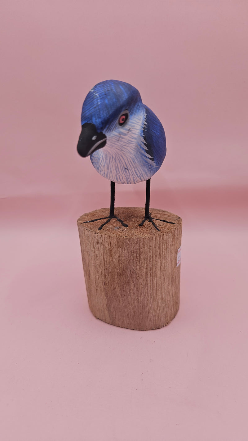 Hand-painted blue songbird figurine on a wood stump, approx. 5.5x2.5 inches