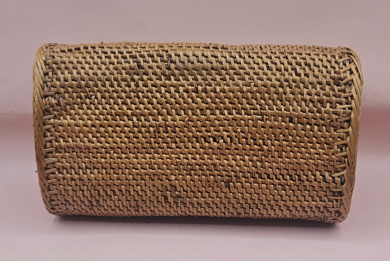 Handwoven rattan clutch with leather strap closure