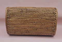 Handwoven rattan clutch with leather strap closure