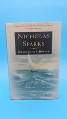1998 hardcover edition of Message in a Bottle by Nicholas Sparks with dust jacket showing sailboat on ocean waves.