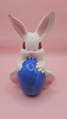 Vintage ceramic bunny rabbit holding a blue egg. 6