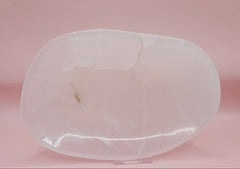 Polished white onyx dish with subtle marbling