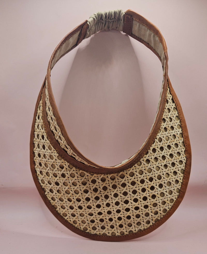 woven rattan visors with faux leather trim in black, red, green, and brown