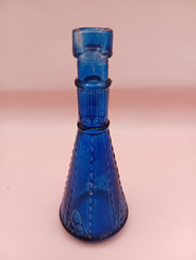 Miniature clear apothecary-style glass bottle with embossed design, no stopper, from Shell World