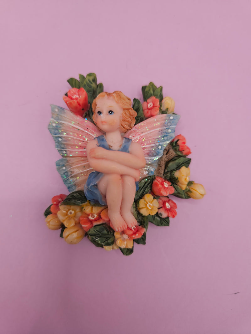 Fairy garden magnets with pastel wings and floral designs, each measuring approximately 3 inches.