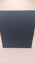 vintage hardcover book The Book of Texas Bays by Jim Blackburn, dark blue with gold text, published by Texas A&M University Press.