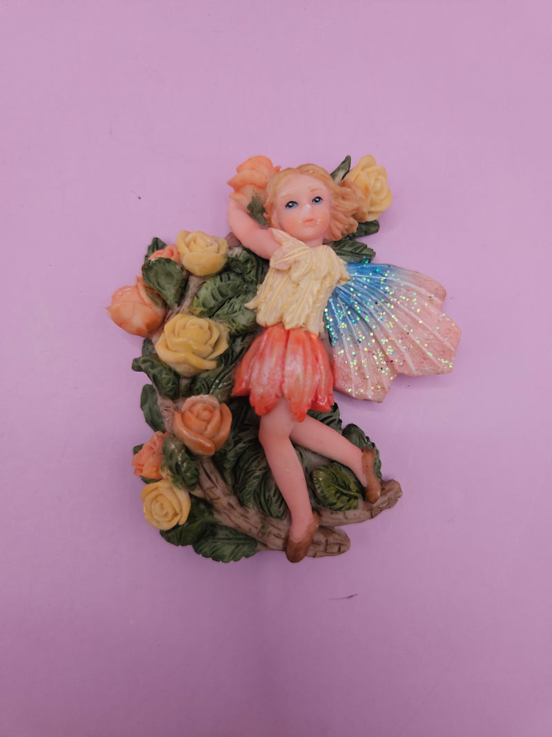 Fairy garden magnets with pastel wings and floral designs, each measuring approximately 3 inches.