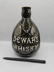  vintage Dewar's Whiskey ceramic decanter, measuring 7.5