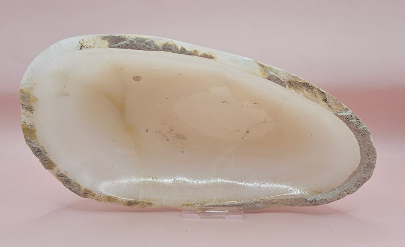Raw-edge onyx dish with creamy polished interior 