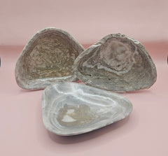 Polished natural onyx shell bowls with layered cream, gray, and brown tones