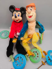 Vintage Flintstone and Minnie Mouse puppets, showing signs of wear, sold as-is for parts or restoration projects.