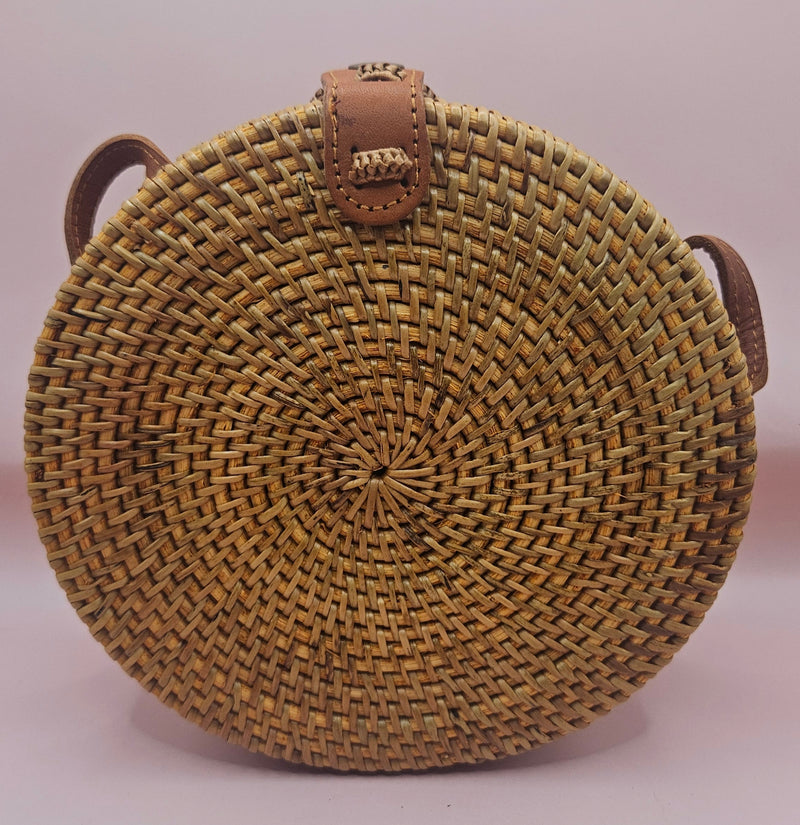 Round rattan crossbody bags in 4 styles—natural, pink, whitewash, and floral weave—with fabric-lined interior