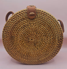 Round rattan crossbody bags in 4 styles—natural, pink, whitewash, and floral weave—with fabric-lined interior