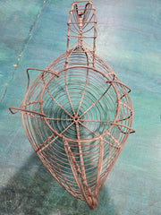 Vintage metal wire egg gathering basket in the shape of a hen, measuring 11.5 inches by 8 inches by 7 inches, ideal for farmhouse decor