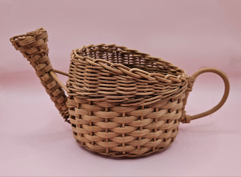 Vintage woven wicker watering can basket with spout and handle, rustic decor piece measuring 8.5x4.25x4.5 inches