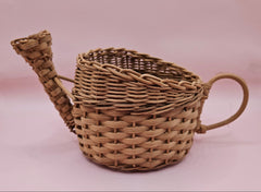 Vintage woven wicker watering can basket with spout and handle, rustic decor piece measuring 8.5x4.25x4.5 inches