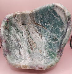and-carved fluorite bowl featuring layers of green, purple, and aqua crystal