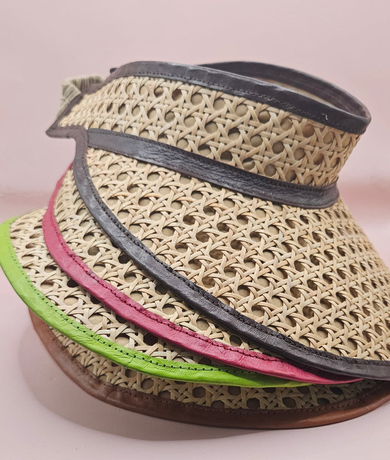  woven rattan visors with faux leather trim in black, red, green, and brown