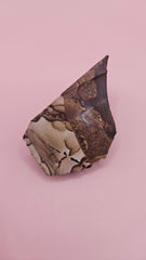 Rough Deschutes Jasper specimen with scenic brown and gold banding, 38g collector’s stone from Oregon shown in hand.
