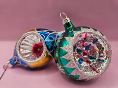 Set of 4 vintage hand-decorated glass Christmas ornaments, featuring teardrop and round designs, with vibrant colors and glitter details