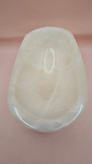 Polished white onyx bowl with smooth curves and a subtle translucent glow, measuring 9.75 inches.
