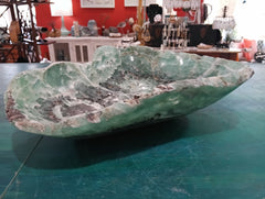 Carved green and purple fluorite crystal bowl with raw edge
