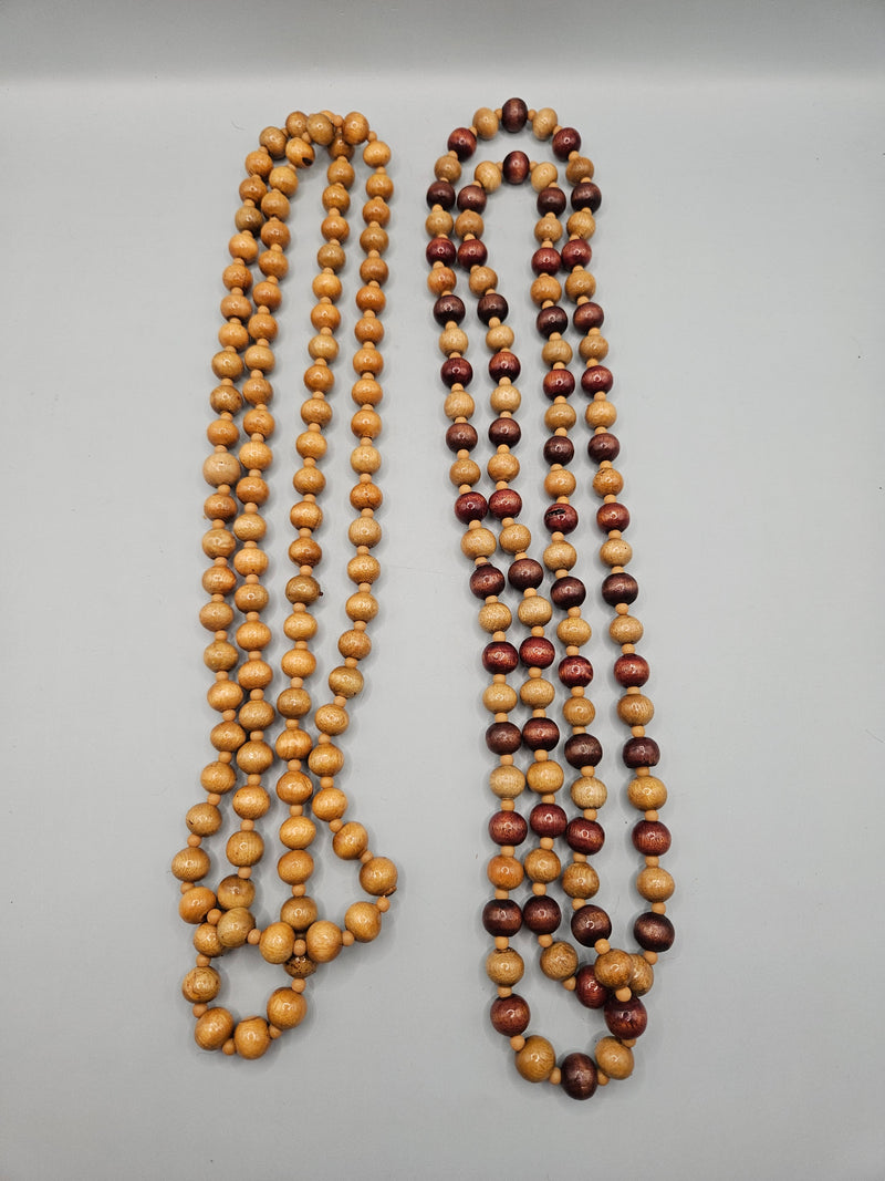 A vintage 24" wood bead necklace featuring natural wooden beads in a boho style