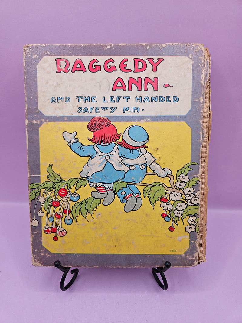 Very rare vintage 1935 edition of Raggedy Ann and the Left Handed Safety Pin by Johnny Gruelle, collectible hardcover book