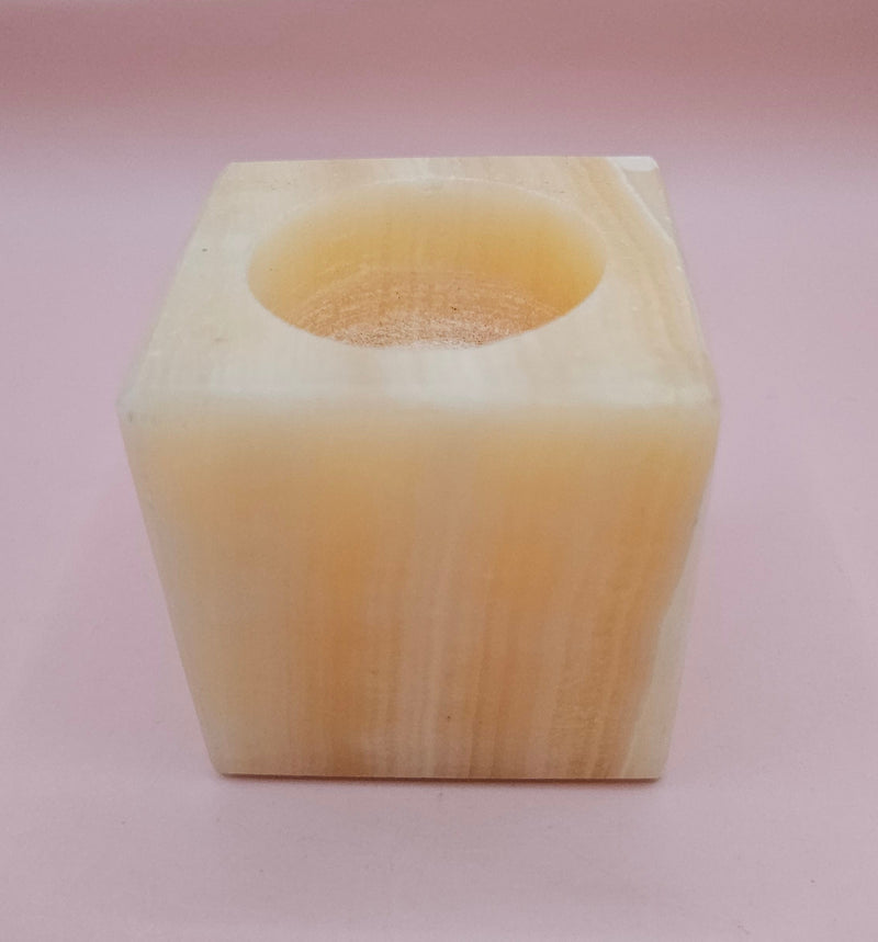 Square natural onyx candle holder with soft golden marbling, sized 2.4x2.4 inches