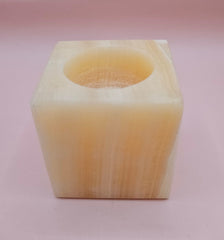 Square natural onyx candle holder with soft golden marbling, sized 2.4x2.4 inches