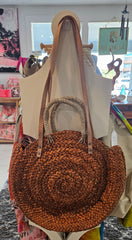 round woven straw tote bags in beige, black, and brown 