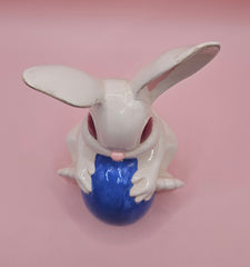 Vintage ceramic bunny rabbit holding a blue egg. 6