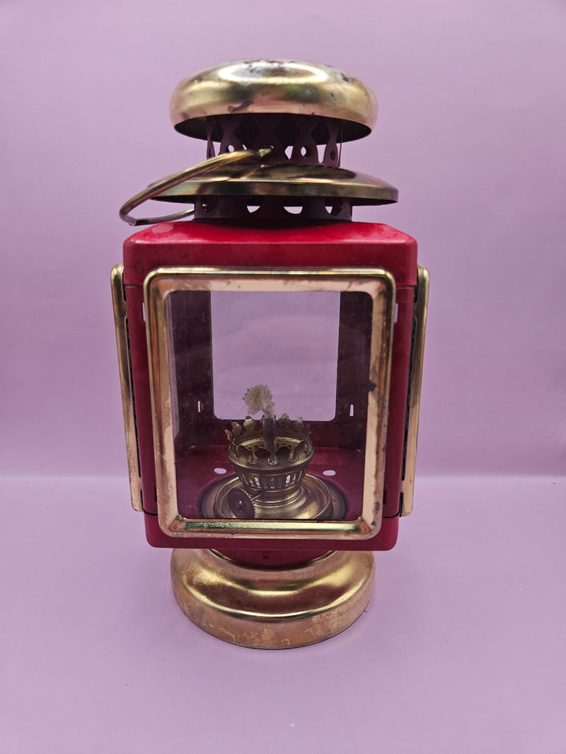 Vintage red and gold nautical oil lamp lantern with glass panels and vent, 7.5 inches by 4 inches, perfect for coastal decor