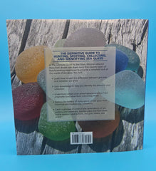 The Ultimate Guide to Sea Glass 2014 hardcover by Mary Beth Beuke, coastal collecting and identification book with colorful blue and green sea glass on wooden dock.