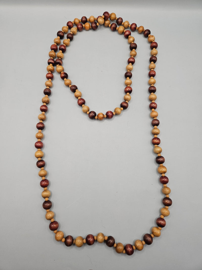 A vintage 24" wood bead necklace featuring natural wooden beads in a boho style