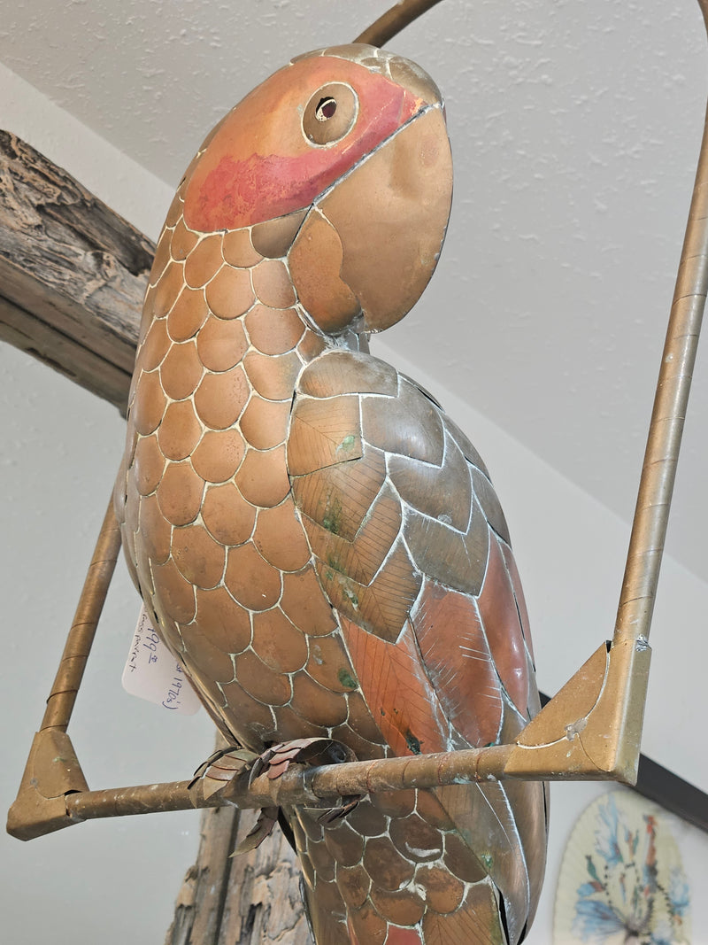 Vintage 1970s brass parrot sculpture on a hanging perch, 43 inches tall