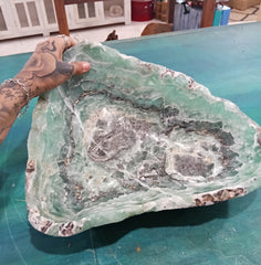 Carved green and purple fluorite crystal bowl with raw edge