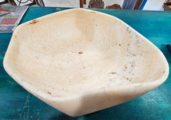 Oversized hand-carved onyx bowl in cream tones with natural marbling, measuring 20 inches wide.