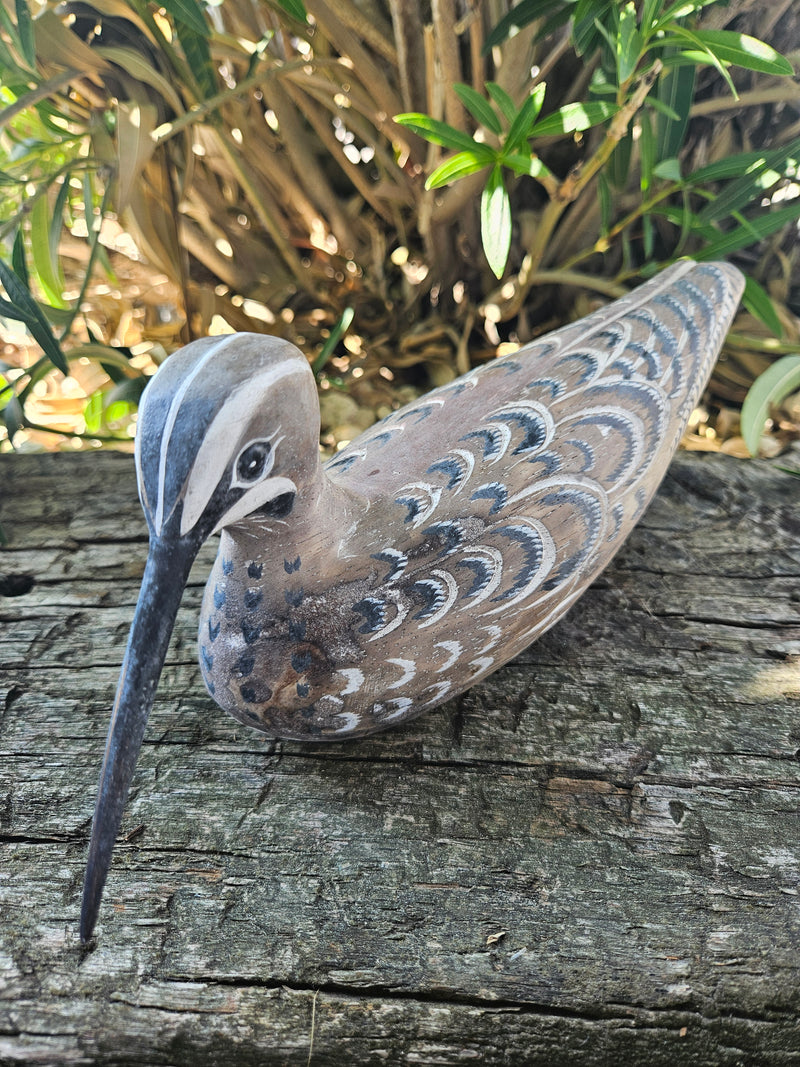 Hand-carved wooden snipe bird sitting decor, 10.5 inches by 3.5 inches, perfect for nature-inspired and coastal decor