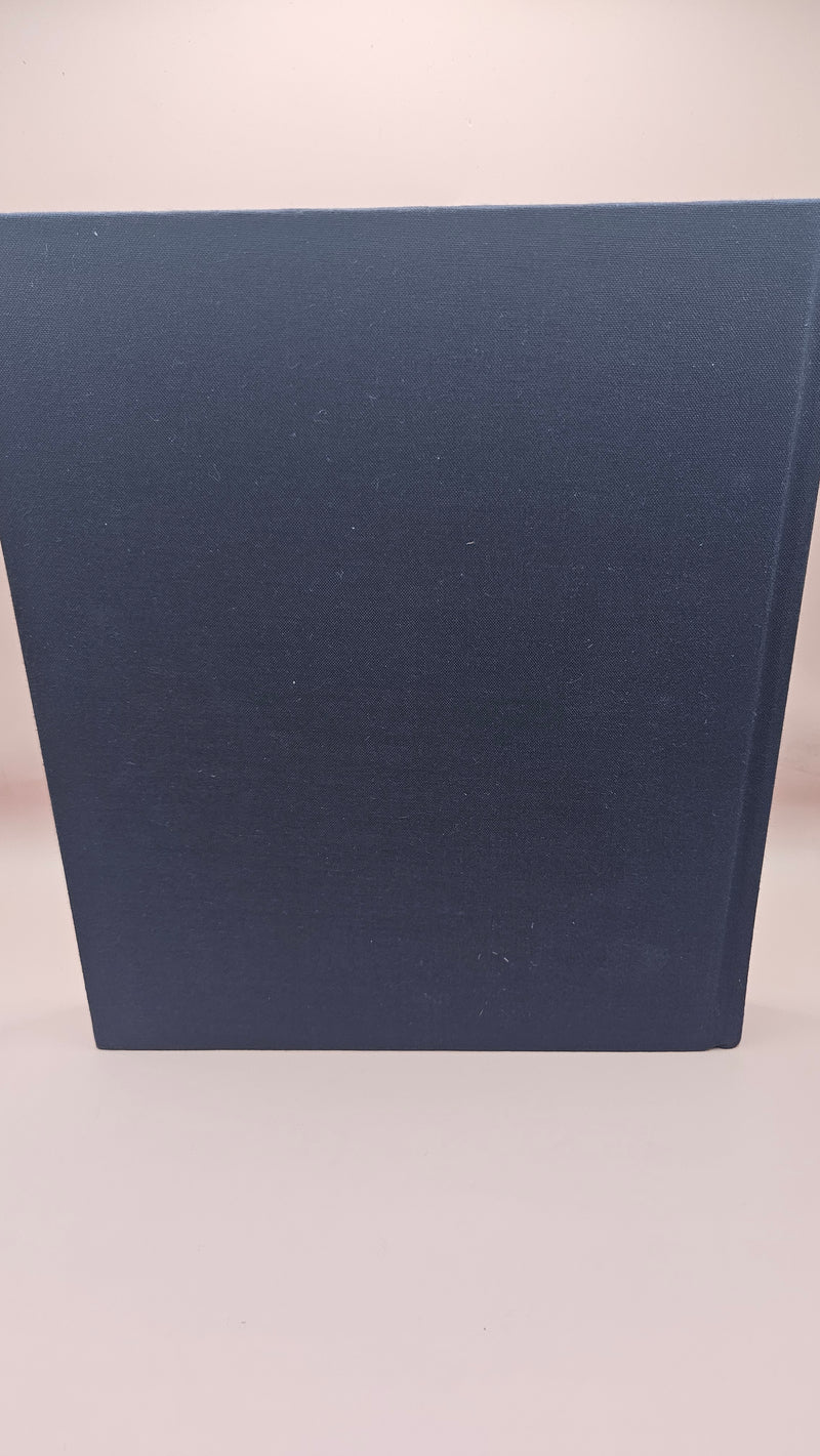 vintage hardcover book The Book of Texas Bays by Jim Blackburn, dark blue with gold text, published by Texas A&M University Press.