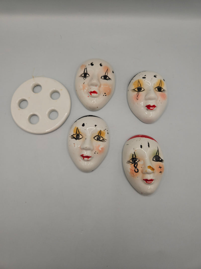 Vintage DIY porcelain mask chime kit with small 2.5"x1.75" porcelain masks, ready for assembly into a decorative wind chime.