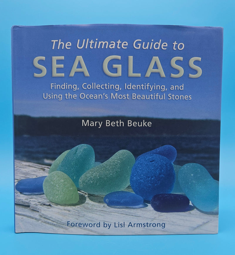 The Ultimate Guide to Sea Glass 2014 hardcover by Mary Beth Beuke, coastal collecting and identification book with colorful blue and green sea glass on wooden dock.