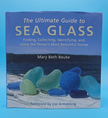 The Ultimate Guide to Sea Glass 2014 hardcover by Mary Beth Beuke, coastal collecting and identification book with colorful blue and green sea glass on wooden dock.