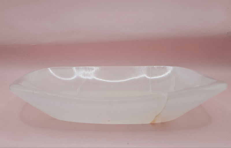 Polished white onyx dish with subtle marbling